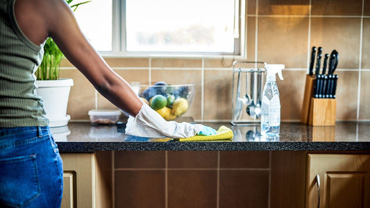 Photo of women cleaning surface counter