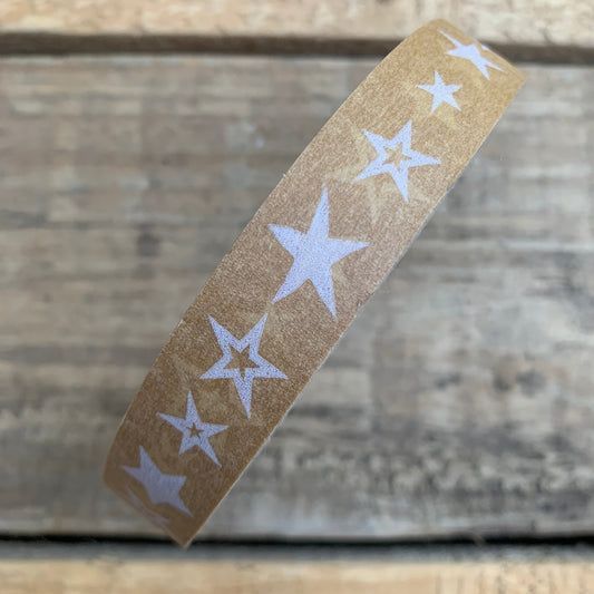 Single roll of paper tape with star design